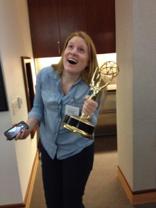 Dallas SWE Secretary Morgen Schroeder has fun posing with one of the many Emmys on display!